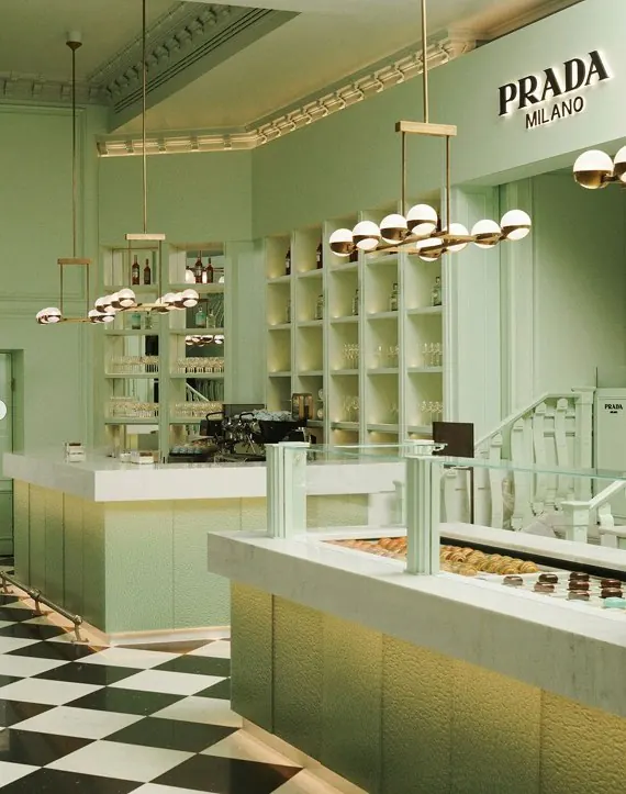 The mint-green interior of Prada Caffè, with a black-and-white checkerboard floor