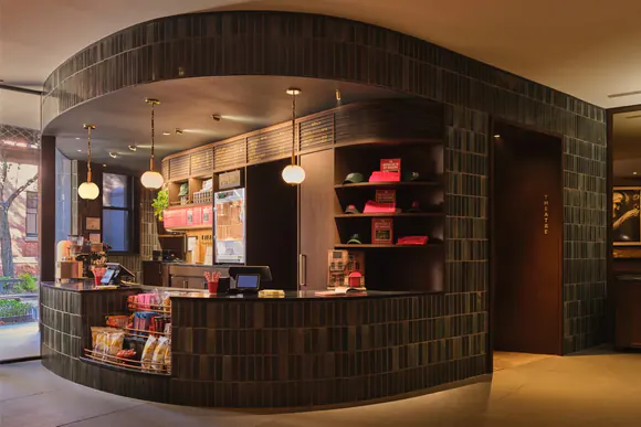 The curved green-tiled concessions counter in the Cherry Lane Theatre lobby